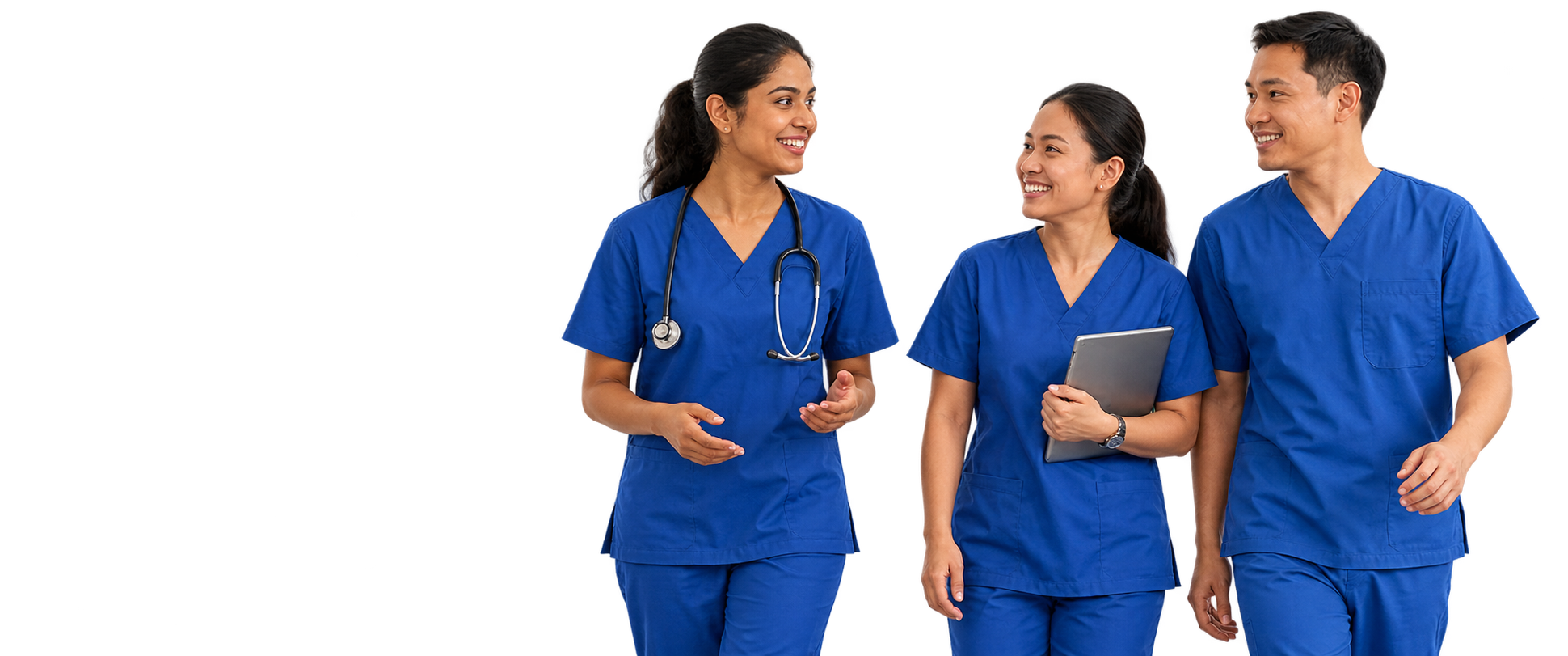Three nurses in blue scrubs walking together and smiling